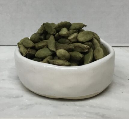Green cardamom pods elevate a range of dishes, from sweet desserts to savory curries, imparting a warm and exotic essence.