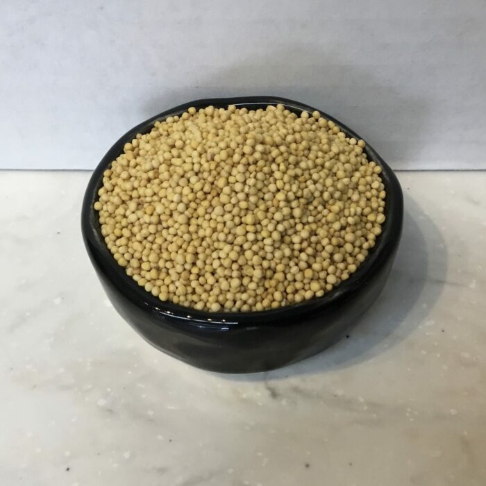 Yellow mustard seeds have a subtle, less pungent flavor compared to their black or brown counterparts, making them versatile in many culinary applications.