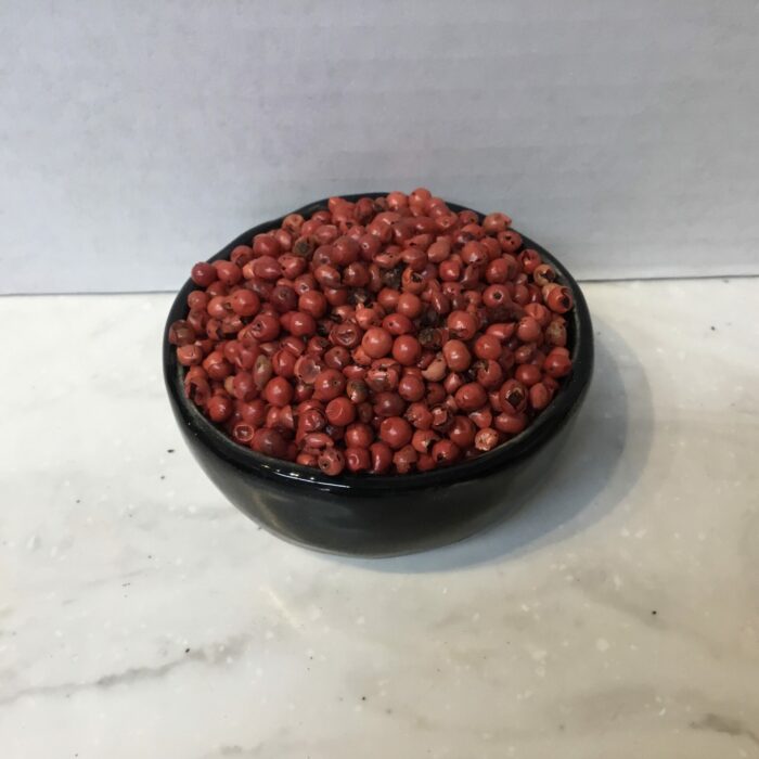 Pink peppercorns, despite their name, are unrelated to black, white, or green peppercorns, and they have a distinctively fruity, sweet flavor with a mild peppery kick.