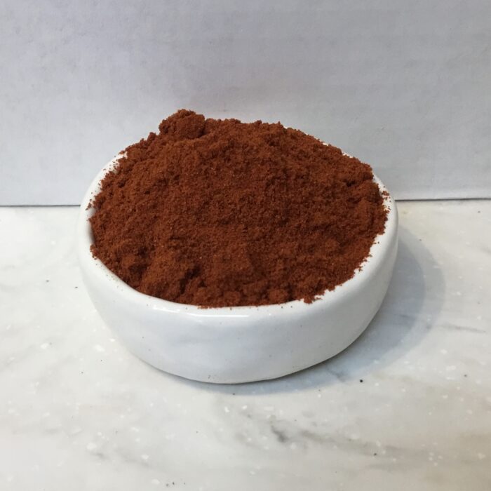 Spanish paprika is characterized by its deep red color and rich, smoky flavor and originates from Spain, where it is a staple in Spanish cuisine.