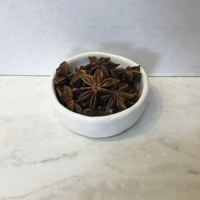 Star anise is derived from the fruit of the Chinese evergreen tree. It has a distinctive star shape and a strong, licorice-like flavor and aroma.