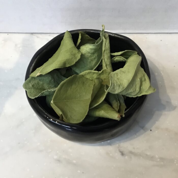 Kaffir lime leaves are aromatic leaves commonly used in Southeast Asian cuisine to impart a distinct citrusy flavor and aroma to dishes.