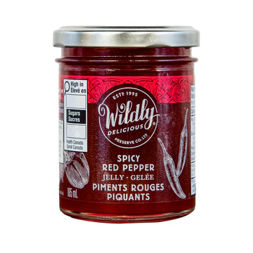 Wildly Delicious Spicy Red Pepper Jelly delivers sweet pepper flavour with a gentle heat. Perfect for cheese boards, glazes, and appetizers.