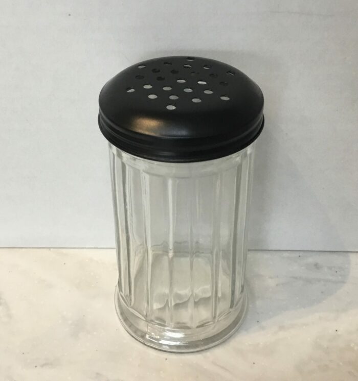 A sleek and practical glass spice shaker, perfect for storing and dispensing your favorite spices with ease. Try it with salt, pepper, cinnamon, and more.