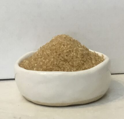 Turbinado Sugar is a natural, lightly processed golden sugar with crunchy crystals and subtle molasses flavor, perfect for baking, drinks, and toppings