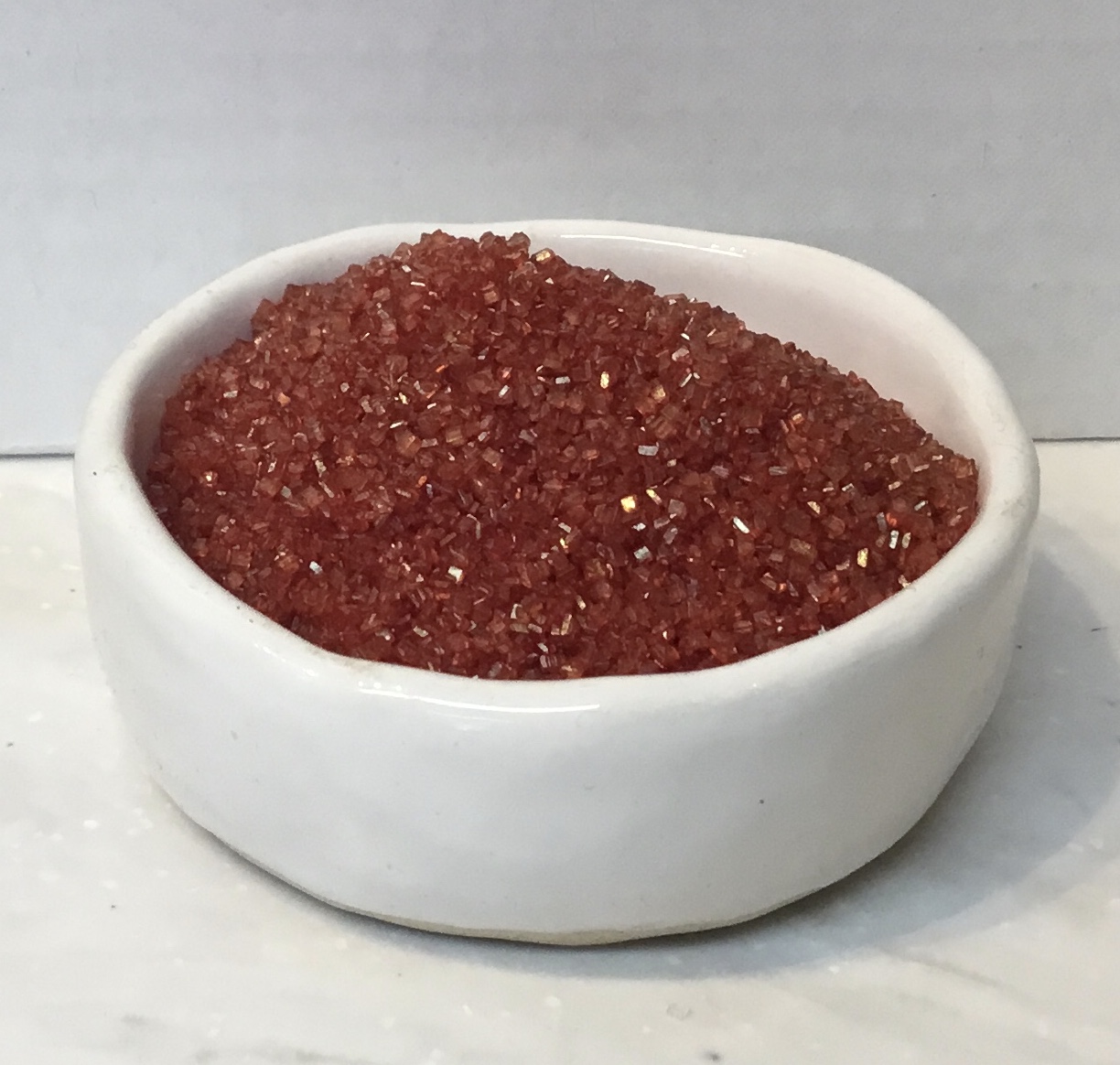 Red sanding sugar Red Sanding Sugar adds vibrant colour, sparkle, and crunchy sweetness to cookies, cupcakes, candies, cocktails, and festive desserts.