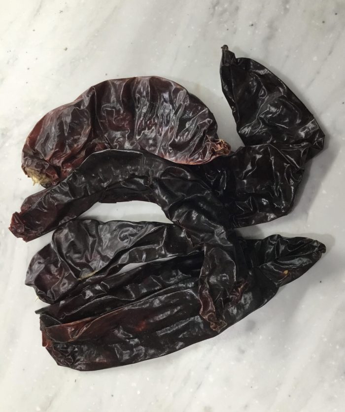Kashmiri chillies, also known as Kashmiri mirch or Kashmiri red chillies, are a type of mild chili pepper primarily grown in the Kashmir region of India.