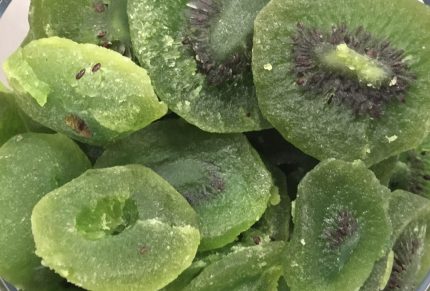 Candied kiwi slices are a delightful sweet treat made by coating slices of fresh kiwifruit with a sugary syrup and then drying them until they become chewy.